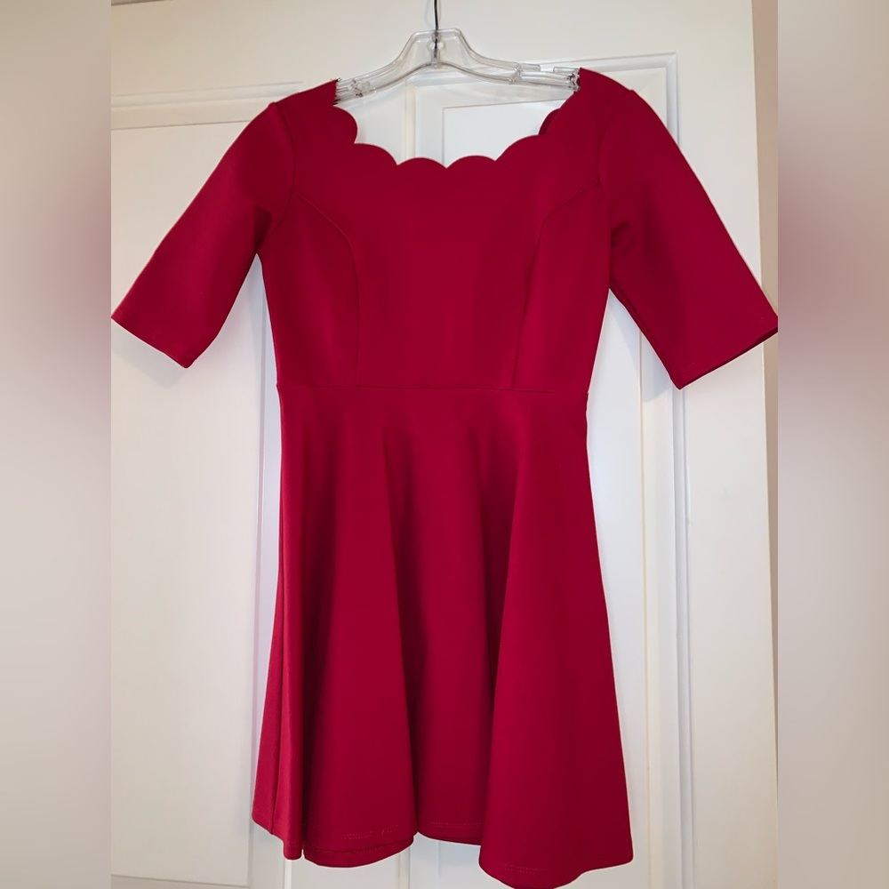Red scalloped neck dress.